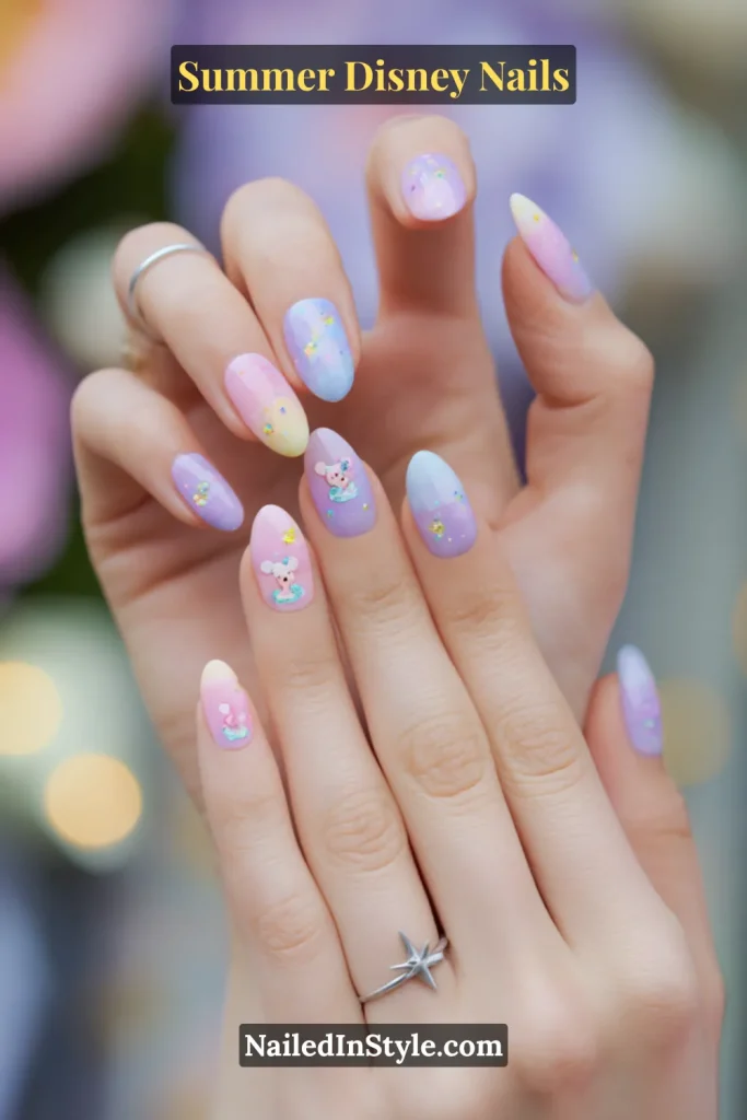Pastel gradient nails with tiny Disney-inspired mouse characters and glittery star accents.