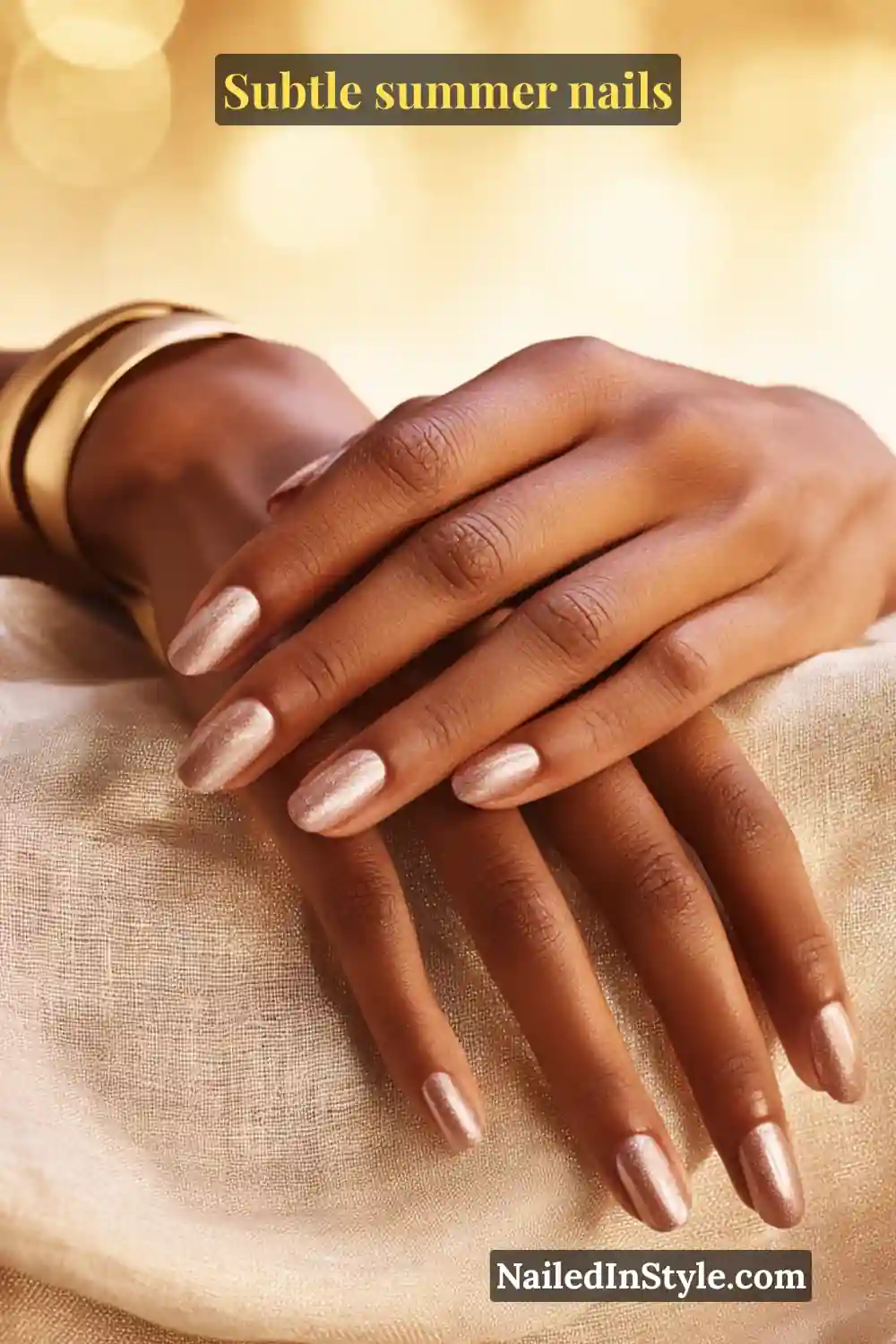 Almond-shaped nails in rosy beige with champagne shimmer, designed to complement medium skin tones for a bronzed, glowing summer effect.