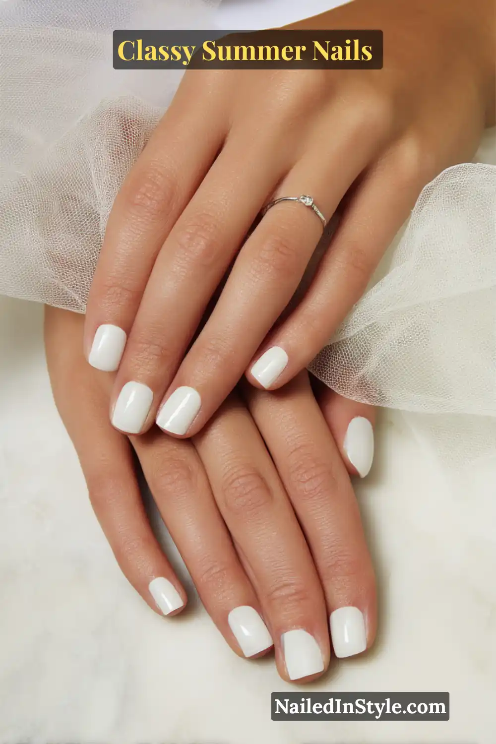 Classy Summer Nails 2026 Trends You’ll Love 18 Short square-shaped nails in a milky white glossy polish, offering a chic and minimalist summer style.