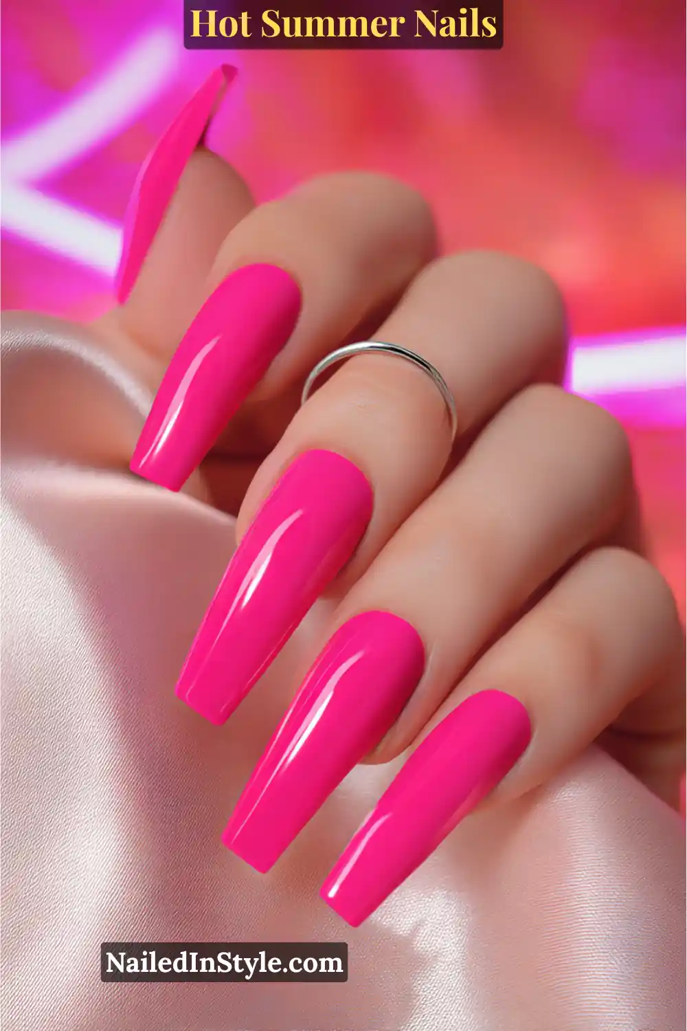 Hot Summer Nails 2025: Bold & Trendy Manicures 12 Close-up of long coffin-shaped nails painted in glossy neon hot pink, radiating bold summer energy.