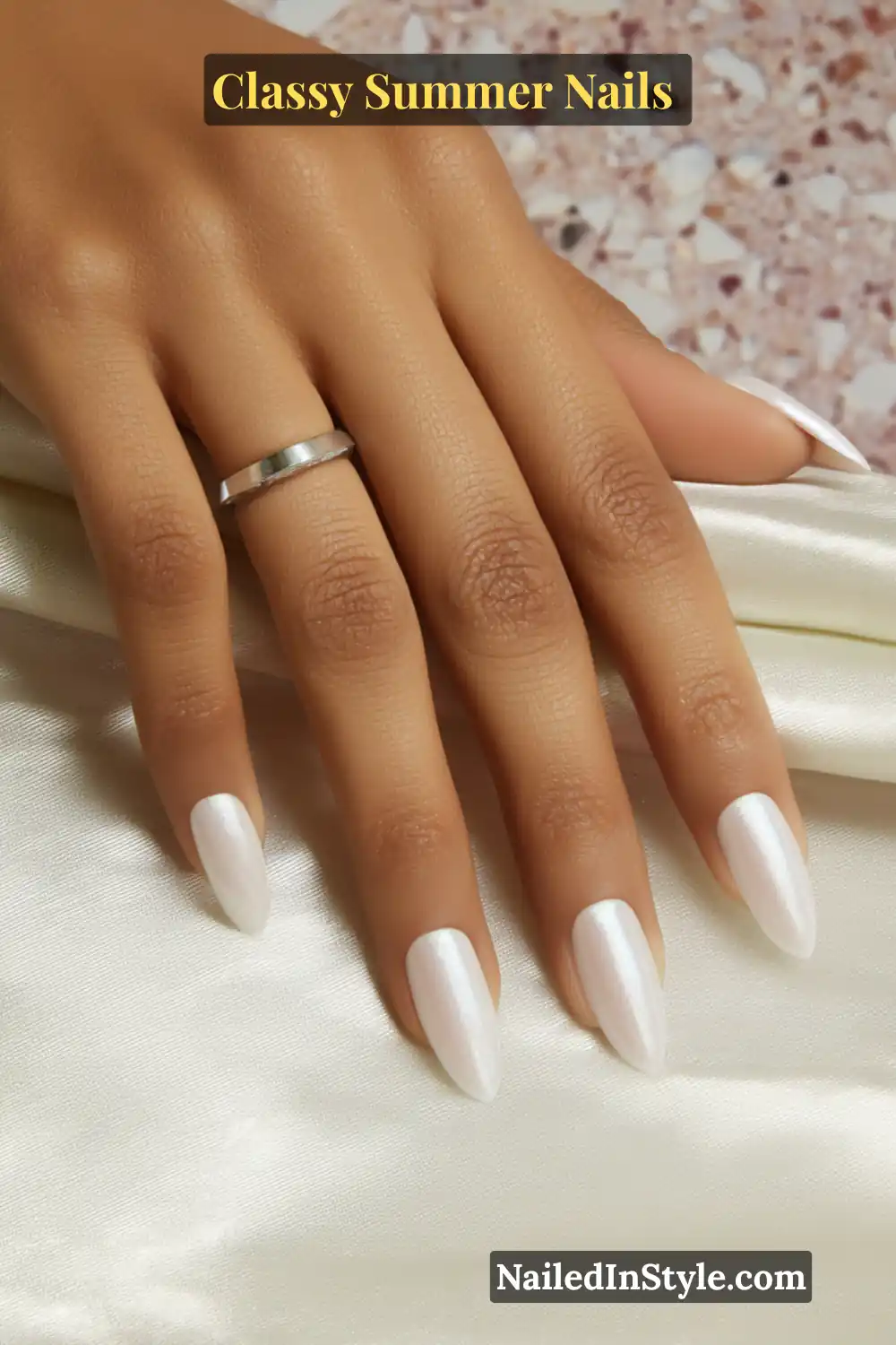 Classy Summer Nails 2026 Trends You’ll Love 15 Almond-shaped nude nails with a subtle pearly chrome glow, creating a chic and modern classy summer manicure.