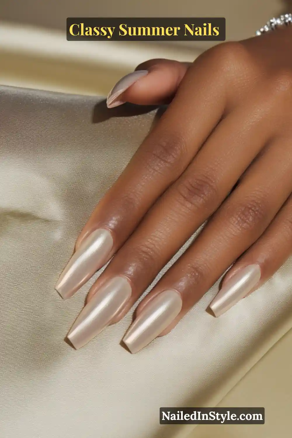 Classy Summer Nails 2026 Trends You’ll Love 9 Long coffin-shaped nails in champagne nude chrome with a pearly finish, designed to complement and pop against olive skin tones.