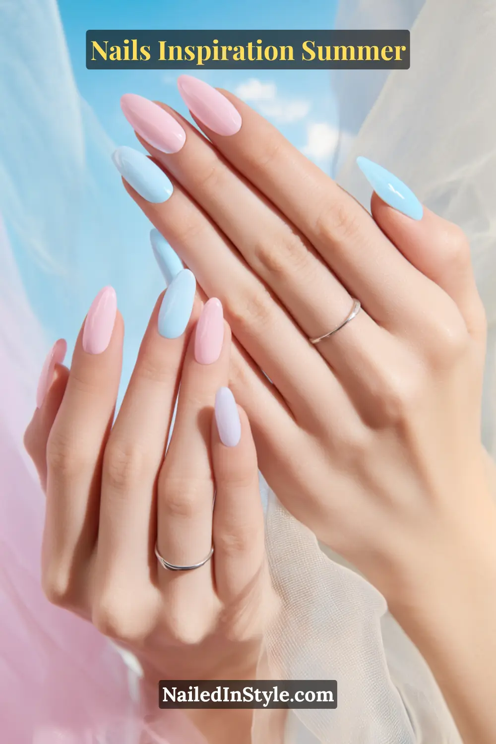 Nails Inspiration Summer 2025: Fresh Trends & Chic Ideas 7 Close-up of long almond-shaped nails painted in alternating baby pink and sky blue shades with a glossy finish, adding a fresh and bright summer vibe.