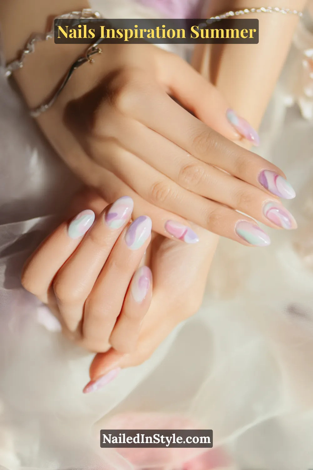 Nails Inspiration Summer 2025: Fresh Trends & Chic Ideas 13 Close-up of almond-shaped nails with dreamy swirls in pastel lilac, mint, and blush pink over a glossy base, creating soft and artistic summer nail inspiration.