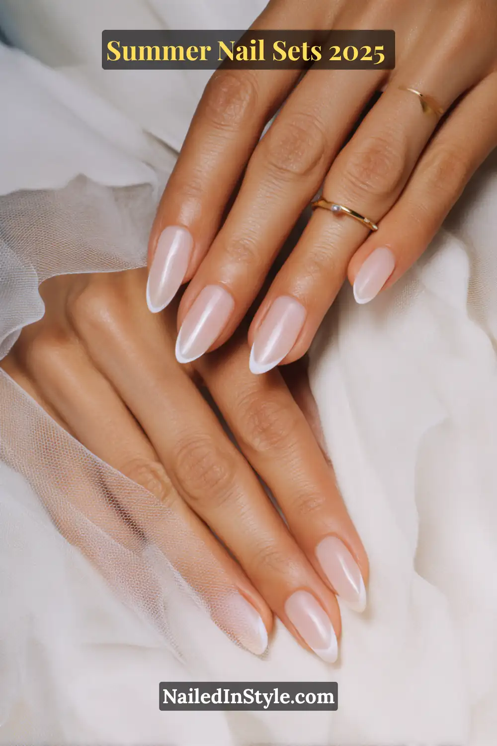 Stunning Summer Nail Sets You’ll Want This Season 13 Elegant almond-shaped nails featuring a milky pink base and thin pearl-white French tips, perfect for a chic summer look.
