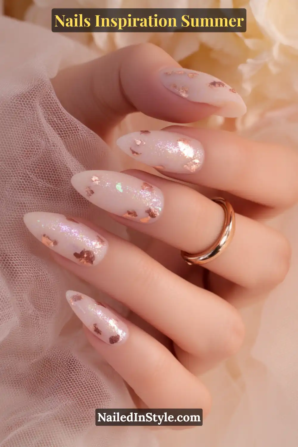Nails Inspiration Summer 2025: Fresh Trends & Chic Ideas 18 Close-up of almond-shaped nails with a sheer nude base, shimmering iridescent glow, and rose gold foil accents for a romantic summer manicure.