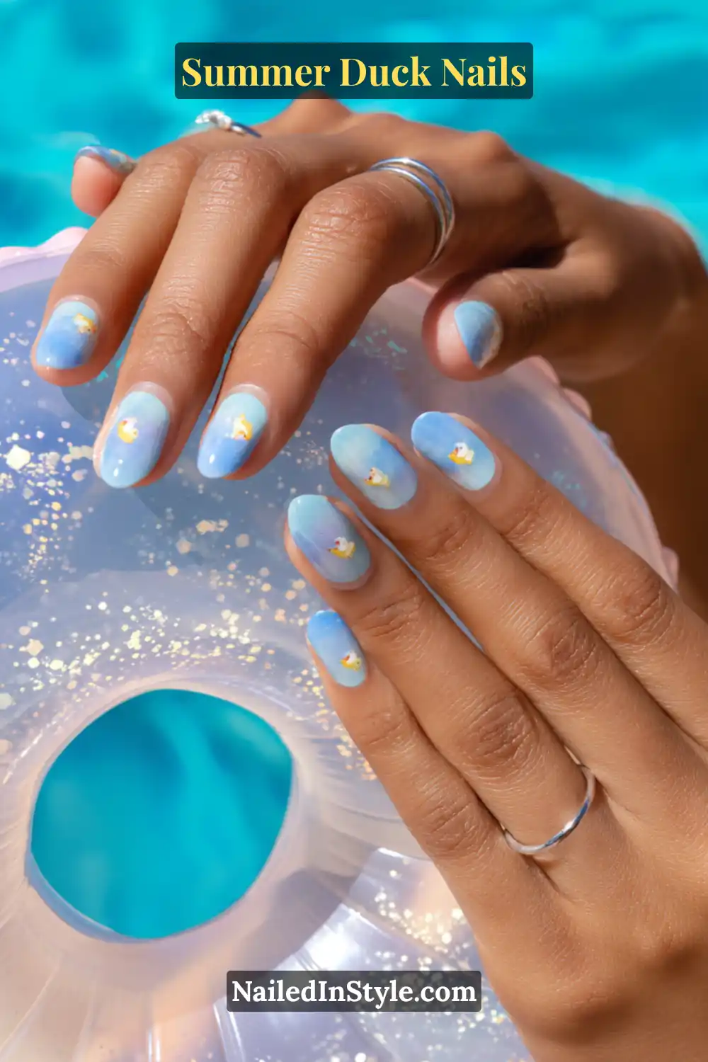 Cute Summer Duck Nails You’ll Want in 2026 12 Aqua ombre nails with tiny floating duck decals, evoking a poolside summer vibe.