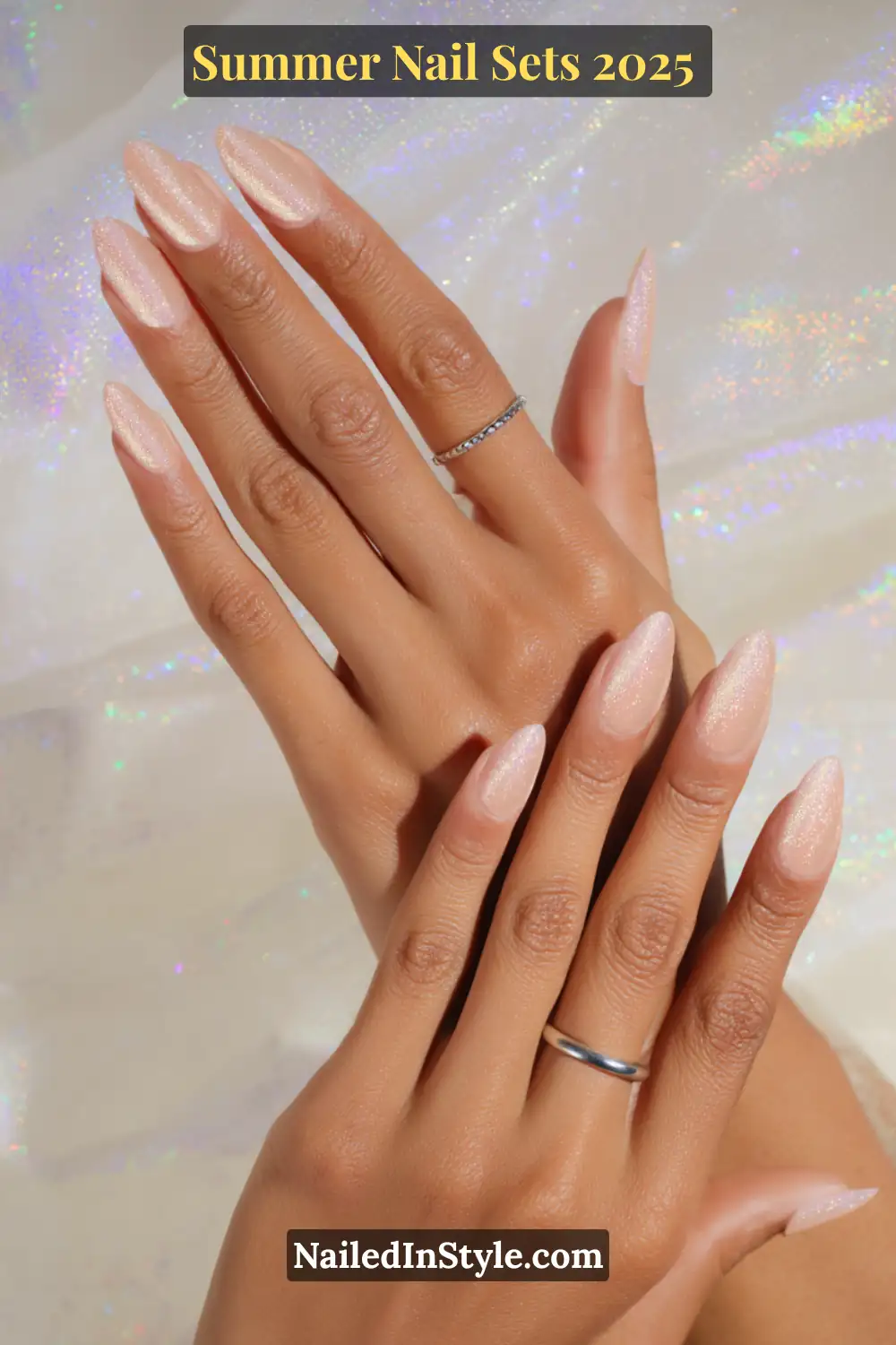 Stunning Summer Nail Sets You’ll Want This Season 21 Nude almond-shaped press-on nails with a subtle holographic shimmer overlay for a chic summer look.