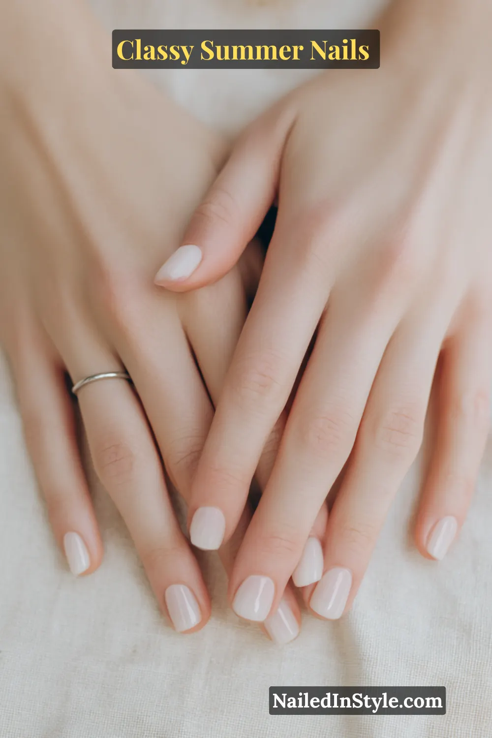 Classy Summer Nails 2026 Trends You’ll Love 6 Short square nails in milky white with sheer peach undertones and a glossy finish, perfect for a minimal classy summer manicure.