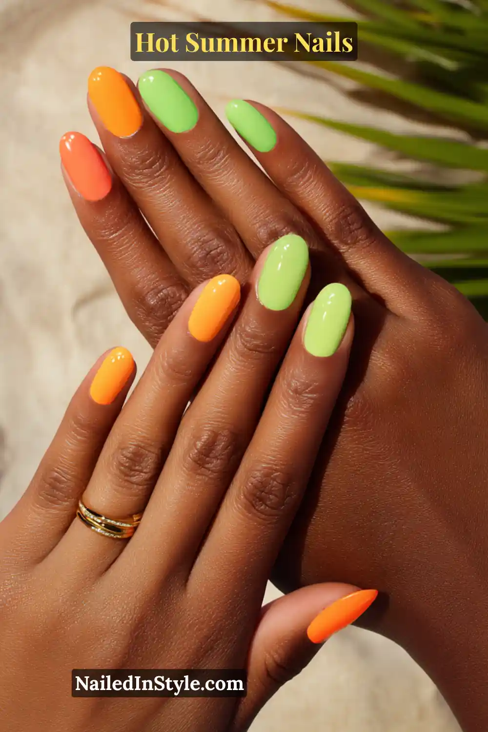 Hot Summer Nails 2025: Bold & Trendy Manicures 10 Close-up of tan skin tone hands with bright orange and lime green nails, complementing a sun-kissed summer glow.
