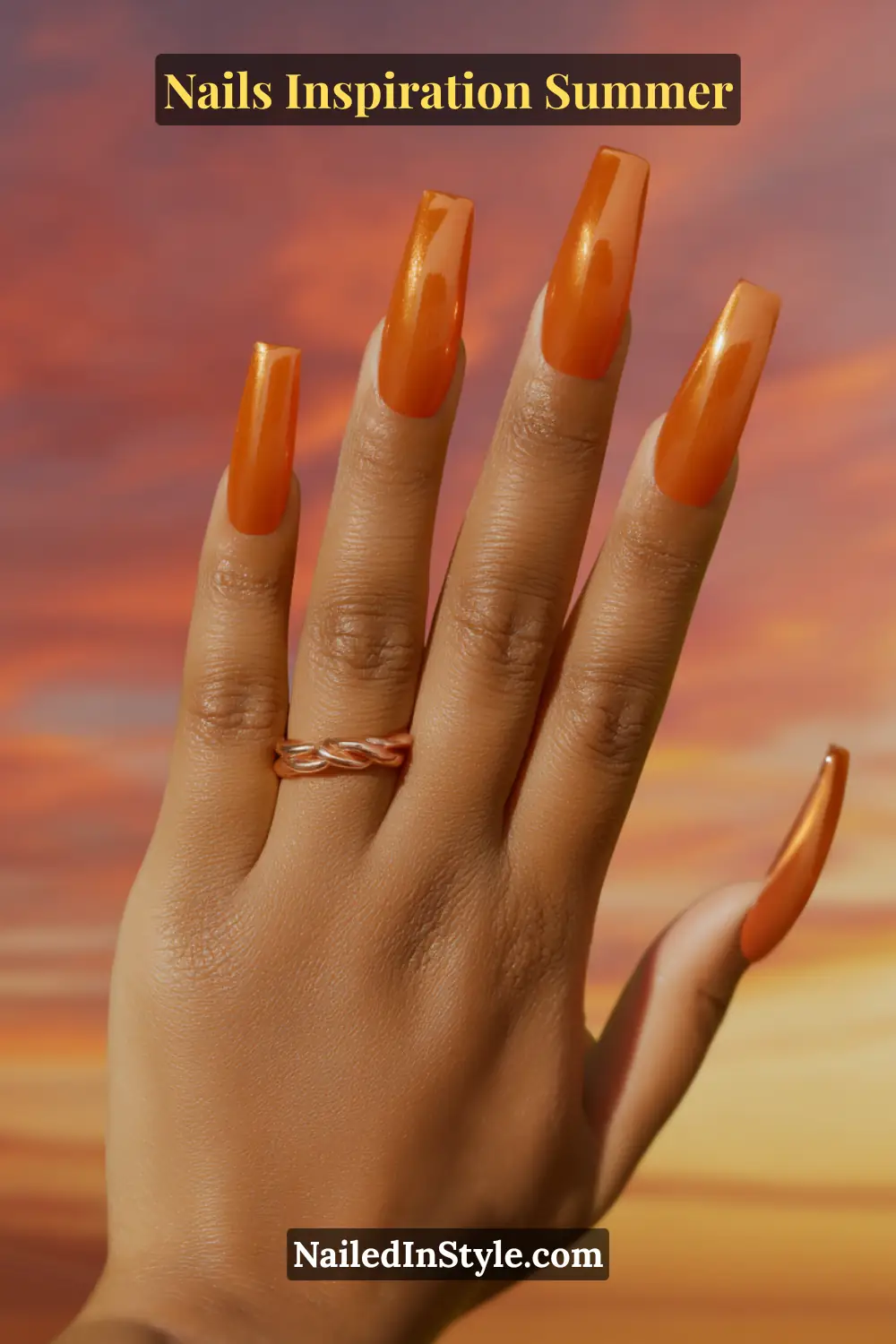 Nails Inspiration Summer 2025: Fresh Trends & Chic Ideas 12 Close-up of long coffin-shaped nails in metallic fiery orange chrome with a glossy, glowing finish, inspired by a summer sunset.