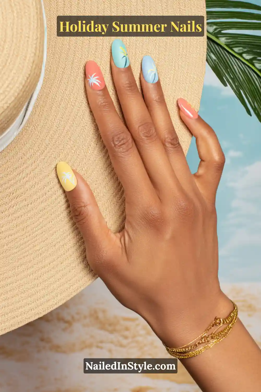 Hand with pastel aqua, coral, and yellow nails featuring delicate palm tree accents, styled against a summer hat and beach backdrop.