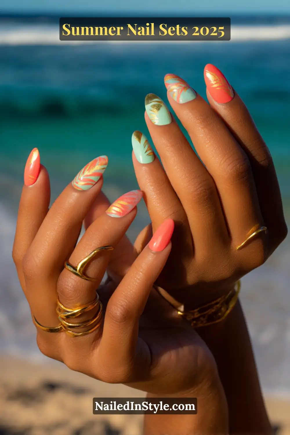 Stunning Summer Nail Sets You’ll Want This Season 2 Almond-shaped nails in coral and seafoam green with gold palm prints and foil accents