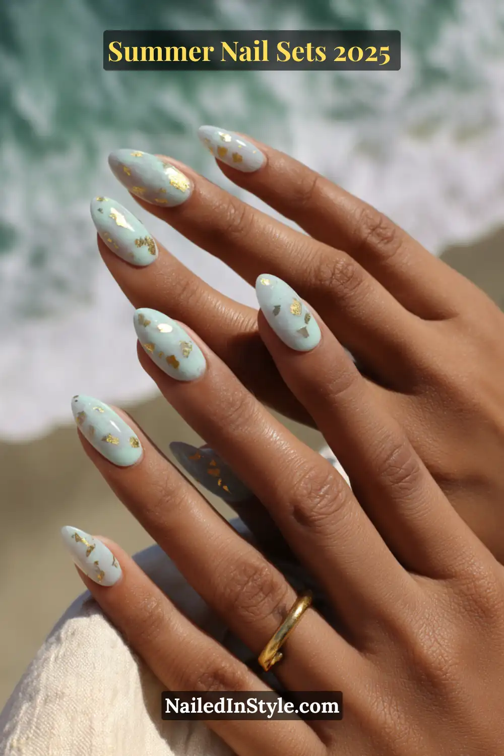 Stunning Summer Nail Sets You’ll Want This Season 20 Elegant seafoam green almond nails decorated with scattered irregular gold foil for a tropical summer vibe.