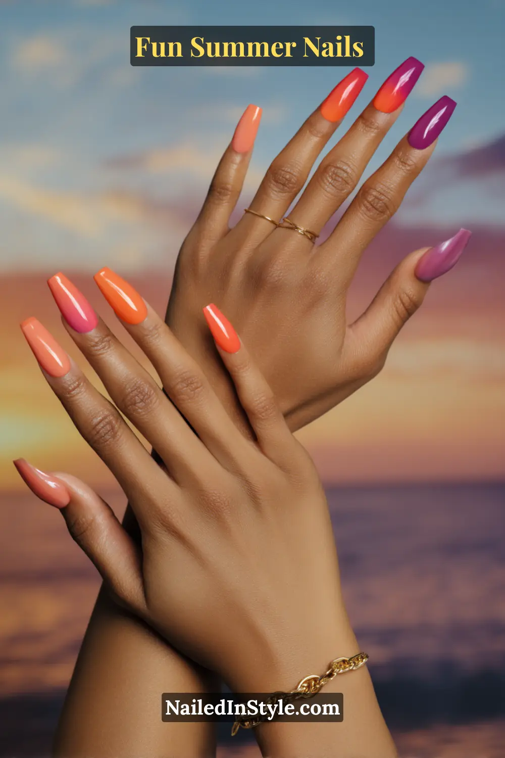 Hands with tropical sunset glow nails featuring a coral, orange, and purple gradient fade inspired by sunset hues.