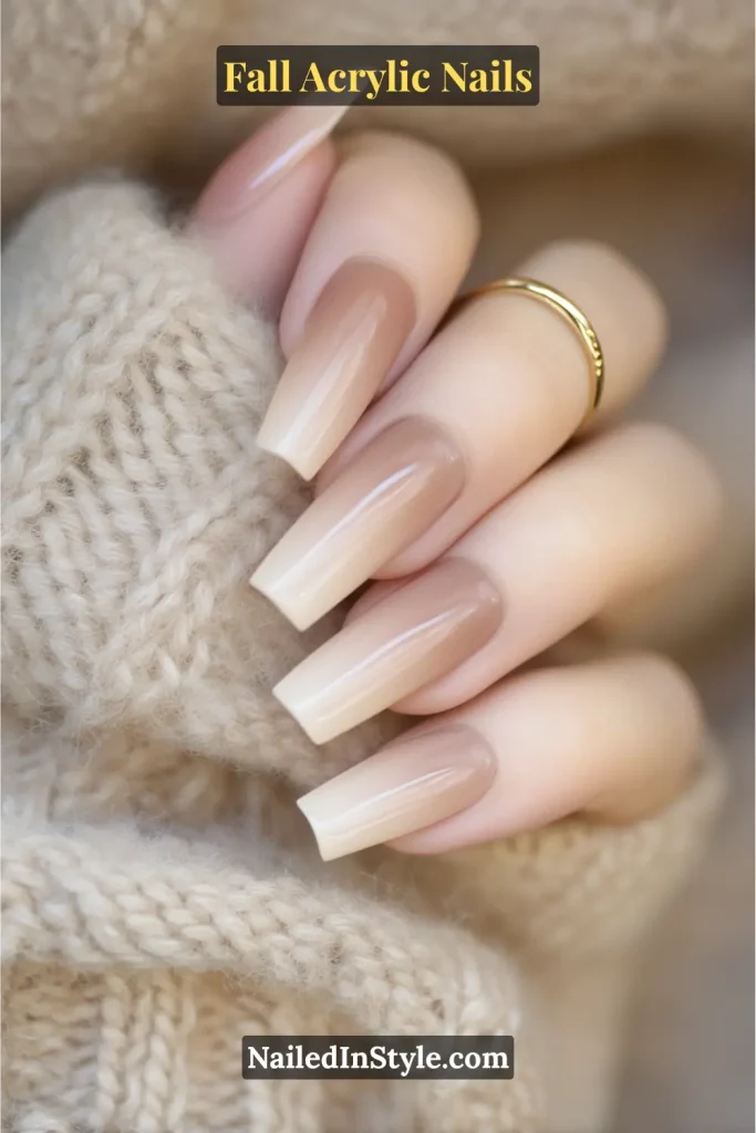 Square-shaped caramel baby-boomer ombré acrylic nails on tan skin, wrapped in a beige knit scarf.