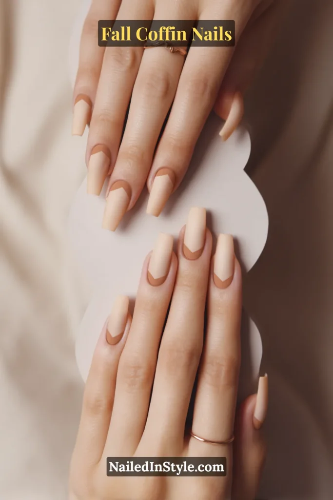 fall coffin nails in cinnamon cloud cuticle design over a latte base, holding a cloud cut-out on soft linen background