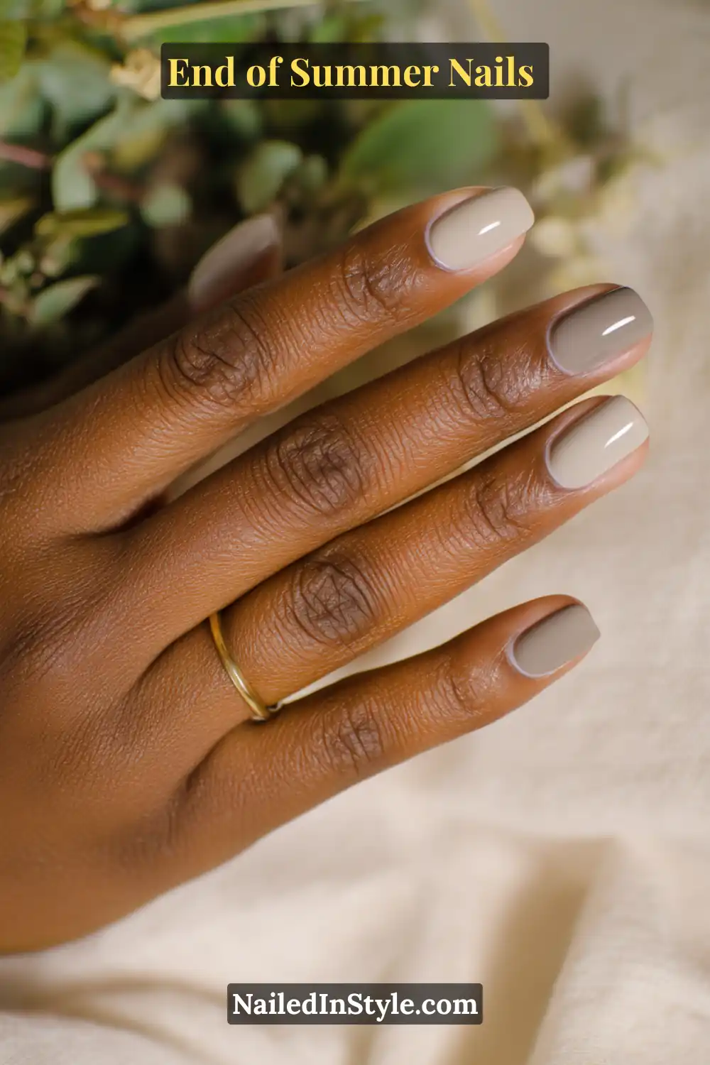 Neutral glossy manicure with taupe, beige, and olive tones for earthy chic end of summer nails.