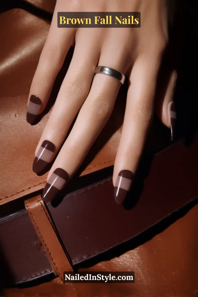 Glossy brown nails with espresso polish at the top and bottom, leaving a clear horizontal band across the middle.