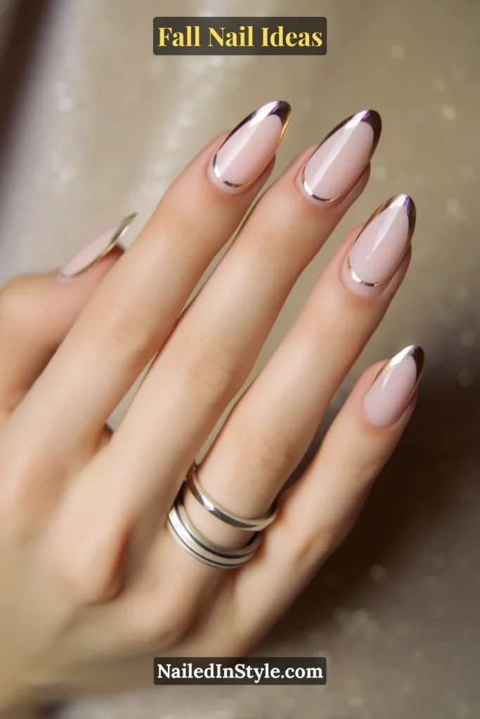 Fall Nail Ideas: 21 Gorgeous Looks to Try Now 13 Nude almond nails with gold and silver double French chrome tips, hand styled with stacked mixed-metal rings.