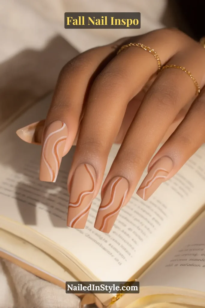Nude matte nails with soft khaki curved line art flowing across each nail.