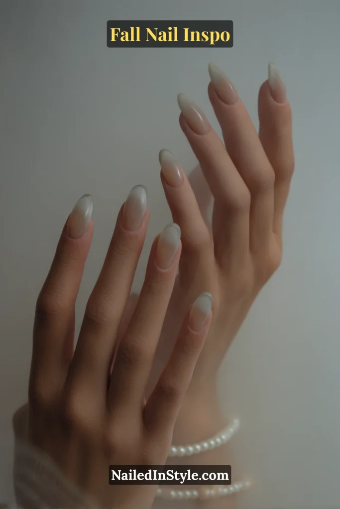 Clear nude nails with soft gray-green gradient feathered along the edges.