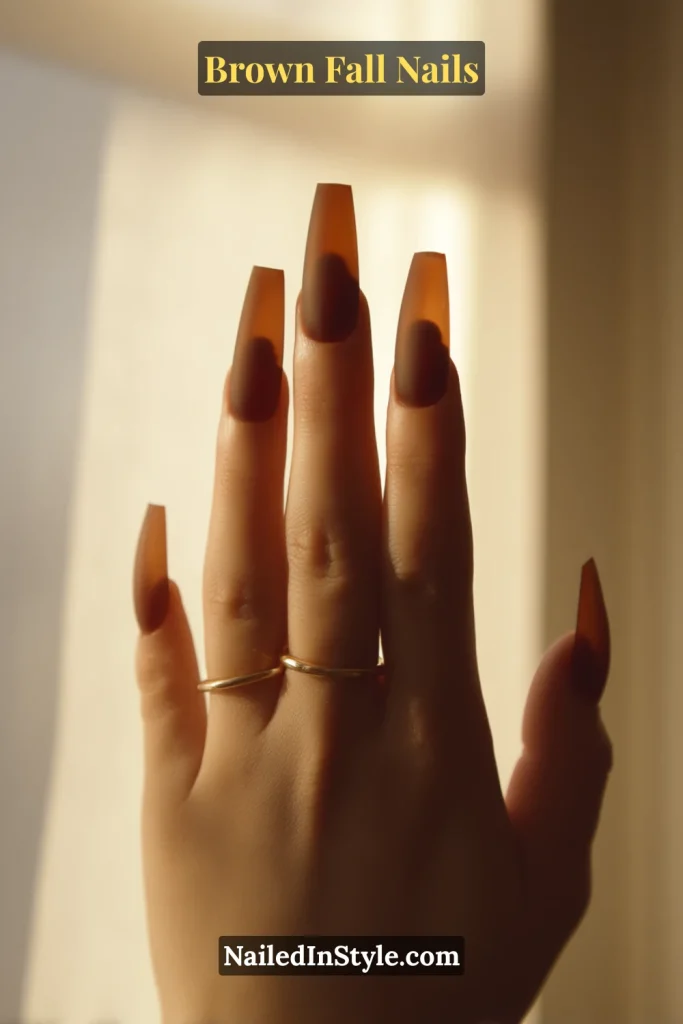 Brown fall nails with matte truffle base and glossy jelly-brown pools centered on each nail.
