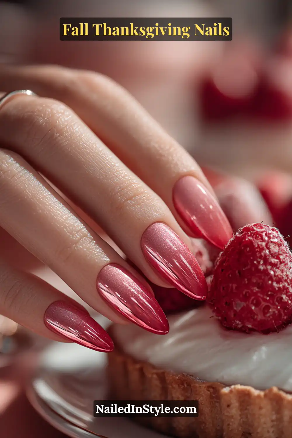 Close-up of berry ombre chrome Thanksgiving nails blending soft pink into deep berry with a glossy chrome finish, styled against a berry tart.