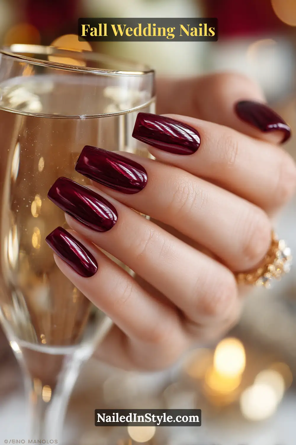 Close-up of glossy cranberry chrome nails, bride holding a champagne flute during a wedding toast.