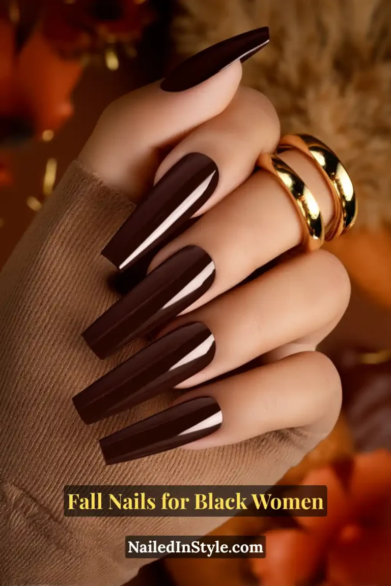 Fall nails for Black women with espresso gloss coffin nails in a deep coffee-brown shine, styled with gold rings and a cozy sweater sleeve.