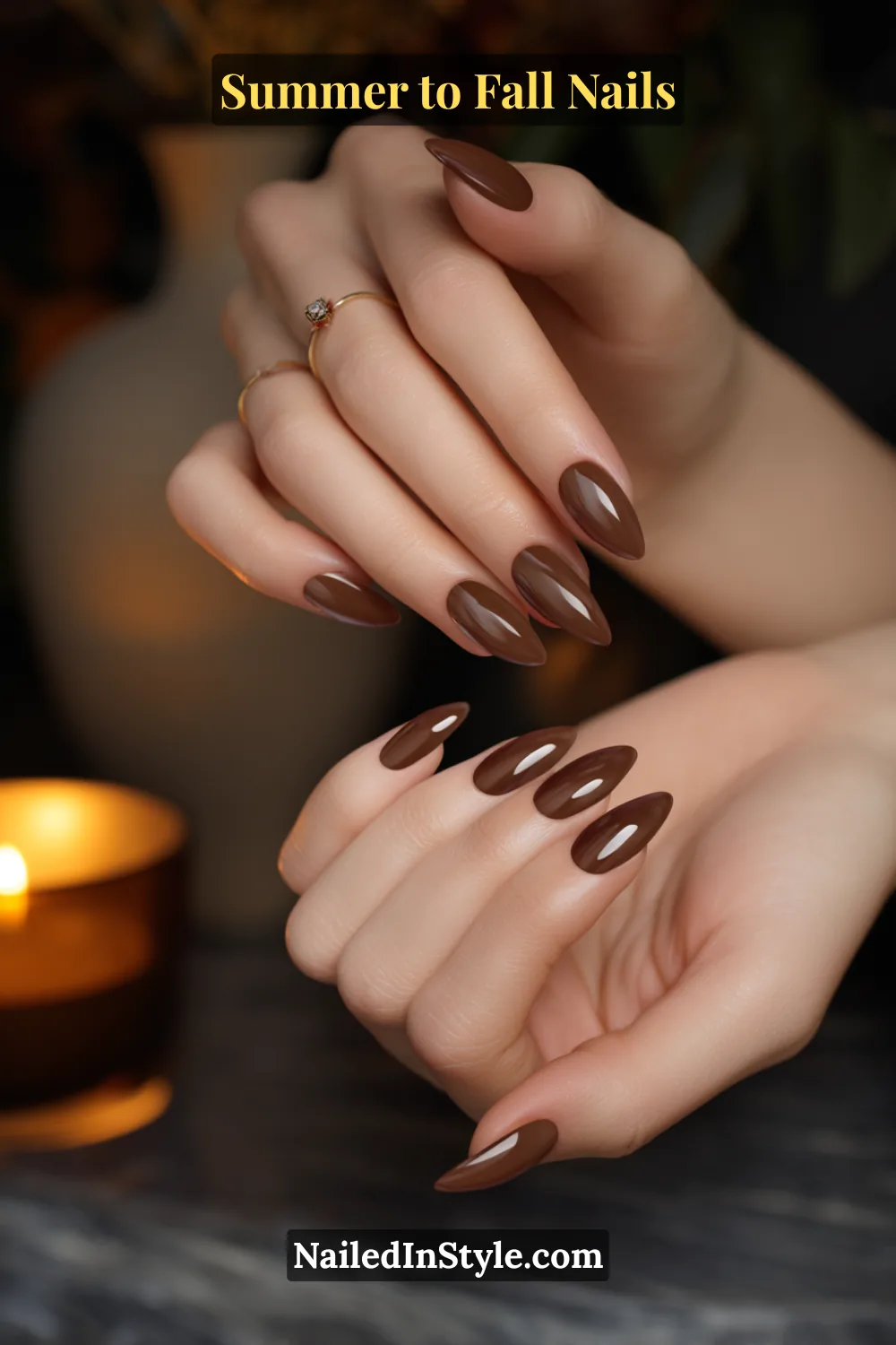 Almond fall nails in cocoa brown with matte base and glossy cuticle cuff arcs, candlelight cozy vibe.