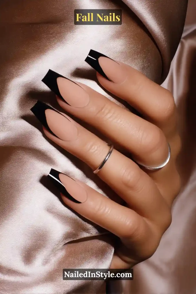 Coffin fall nails in Onyx Negative-Space with near-black crescents and crisp arcs, styled against soft satin reflections.