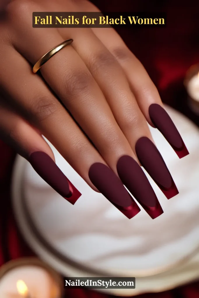 Fall nails for Black women with bold berry French coffin nails, styled at a dinner party table setting.