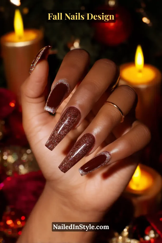Fall Nails Design: Bold, Chic & Gorgeous Ideas 7 Fall nails design with coffin-shaped nails in warm cinnamon brown, finished with sparkling glitter edges, styled under holiday candlelight.