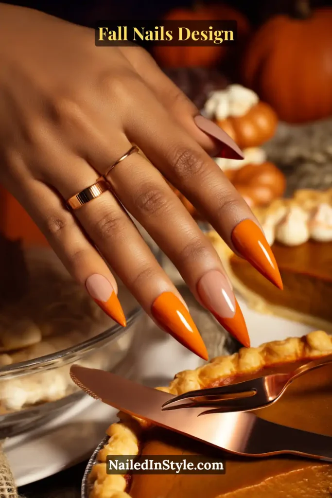 Fall Nails Design: Bold, Chic & Gorgeous Ideas 4 Fall nails design featuring nude base with pumpkin-orange French tips, styled beside pumpkin pie for cozy autumn vibes.