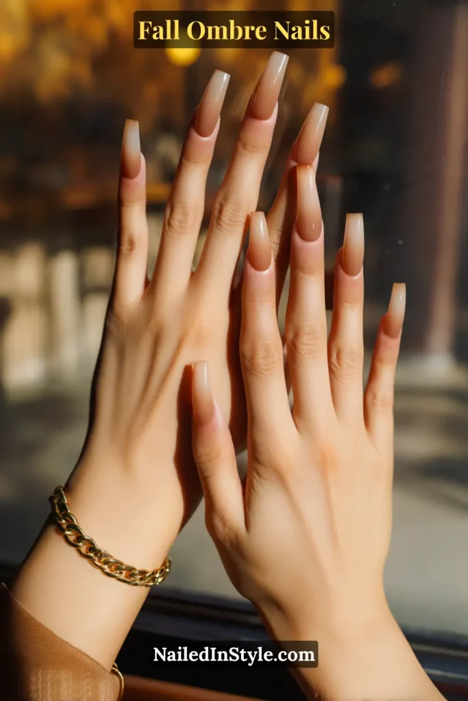 Fall ombre nails in translucent latte nude, deepening at the tips for a glassy jelly effect, styled at a café window.