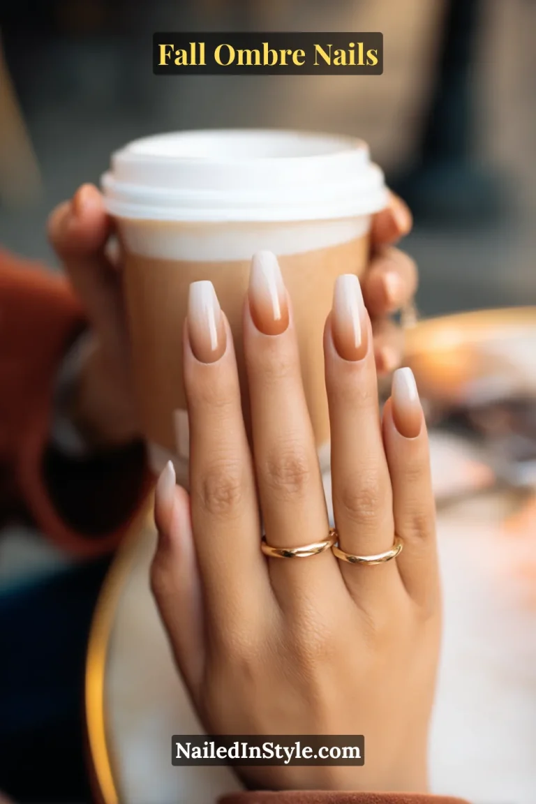 Fall ombre nails with mocha to cream baby boomer fade, styled holding a latte cup with gold rings.