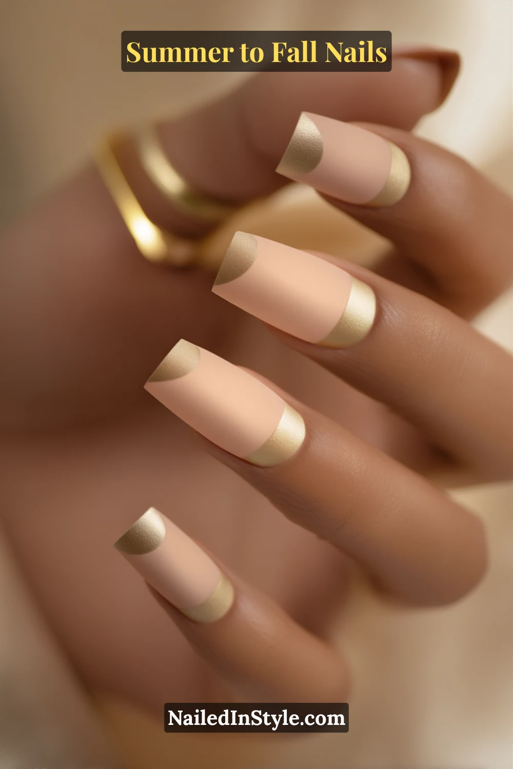 Summer to Fall Nails fall round nails with bronze half-moon accents on a beige base