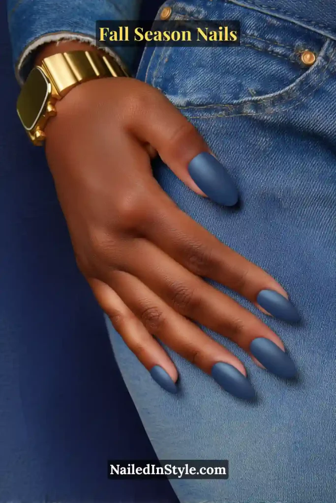 Matte navy nails with smoky diffused edges, styled with denim jeans and a gold watch.