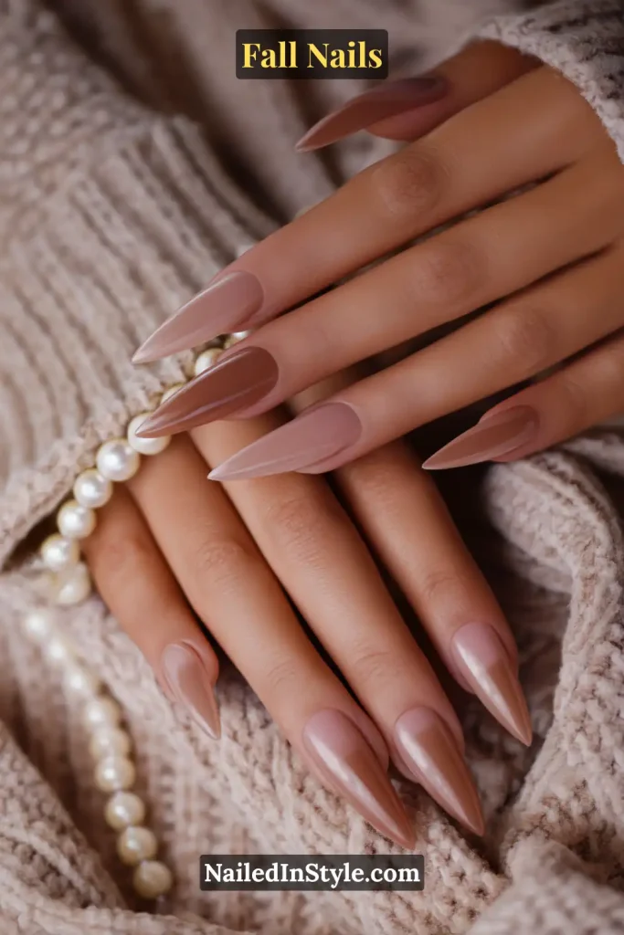 Stiletto fall nails in Rosewood Cloud Fade with sheer rosewood drifting to soft neutral, styled on a knit throw.