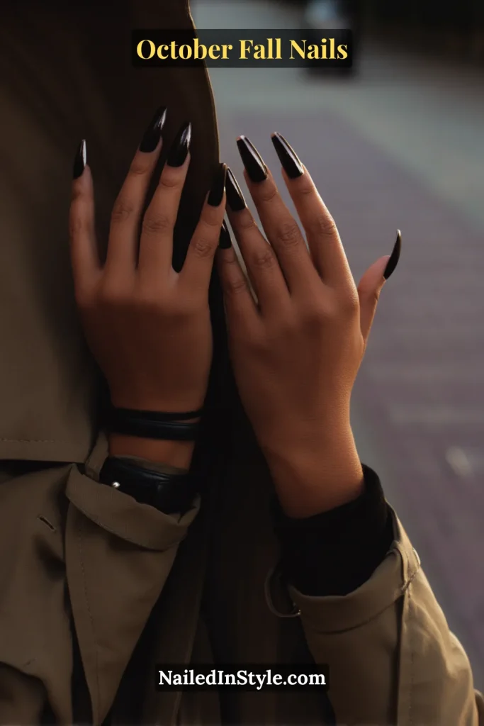 October fall nails with charcoal velvet base and razor-thin glossy French tips, styled with trench coat on a city sidewalk.