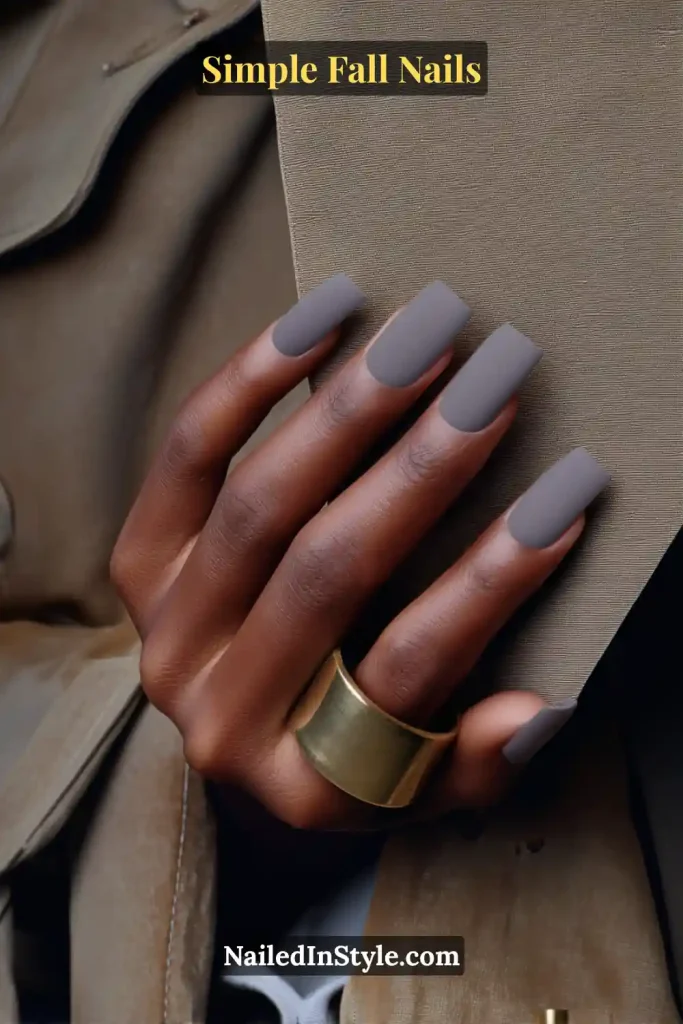 Simple fall nails in matte taupe polish, square shape, styled against a trench coat lapel; knit-soft texture with office-ready elegance.