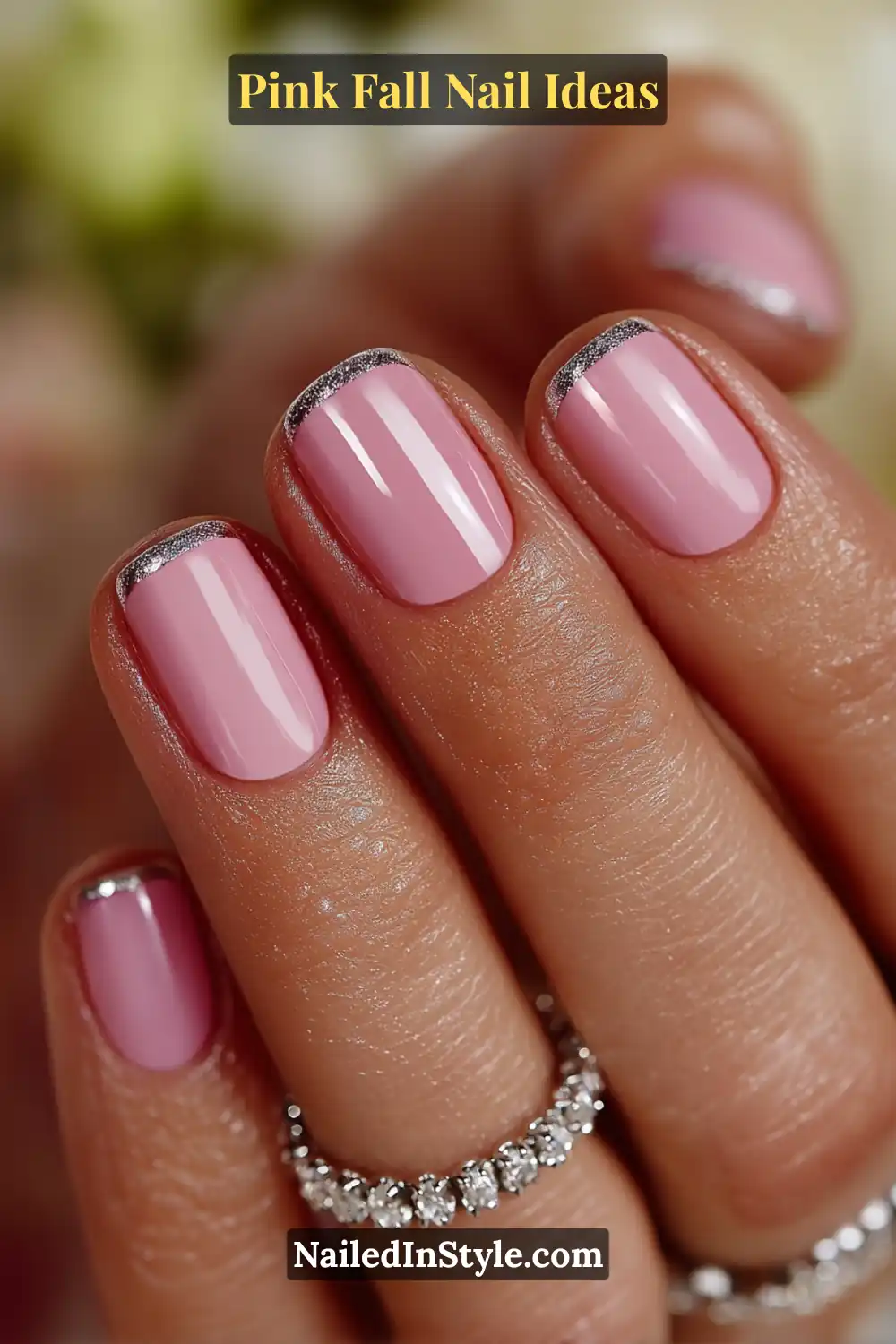 Pink Fall Nail Ideas: Chic, Fast & Photogenic 2025 7 Short square nails in blush pink with soft velvet texture and silver metallic tips, styled beside a sparkling silver bracelet for a polished fall look.