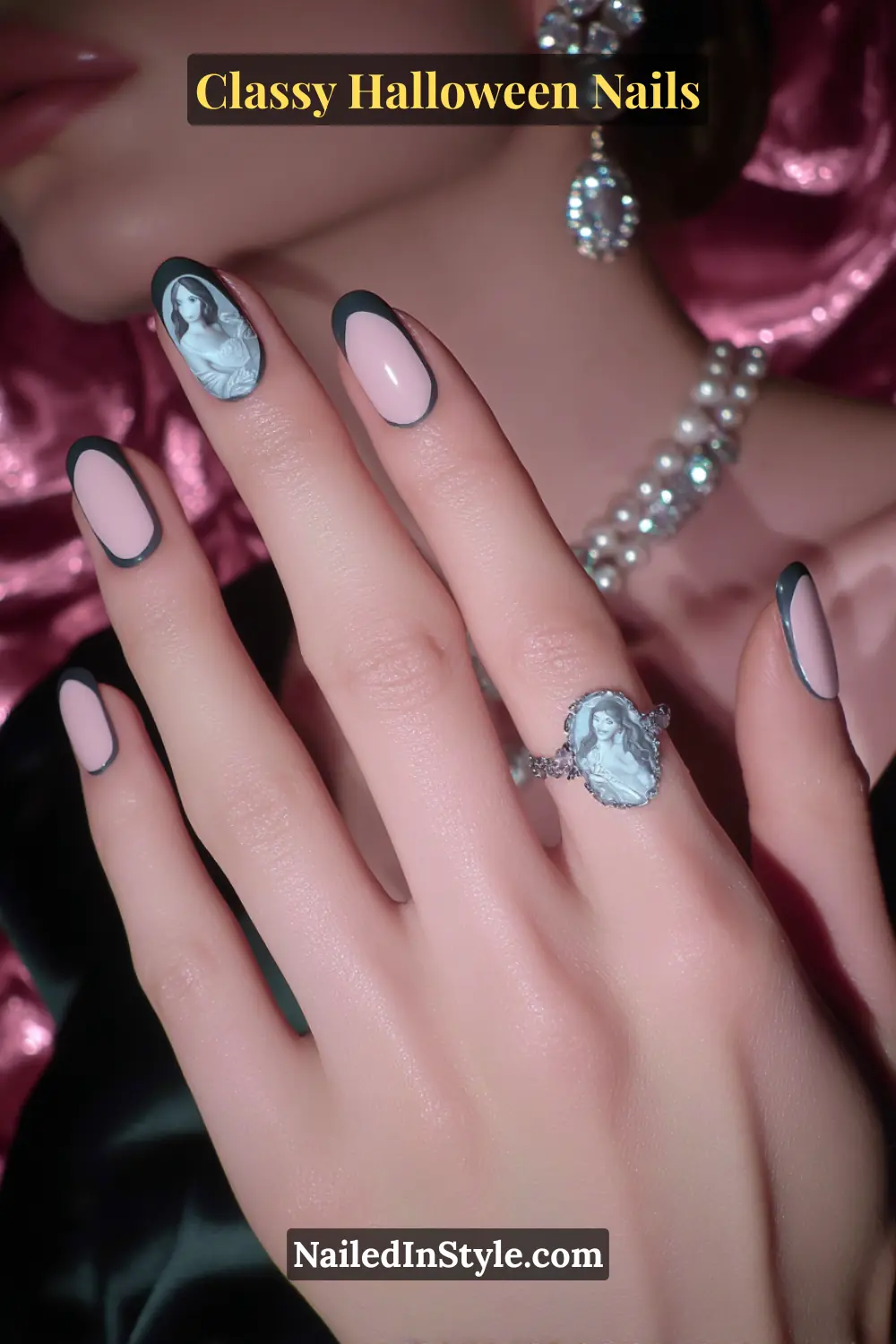 Medium oval nails with a porcelain-pink base edged in graphite, featuring a raised 3D cameo portrait framed in antique gray — an elegant nod to Victorian artistry for a classy Halloween mood.