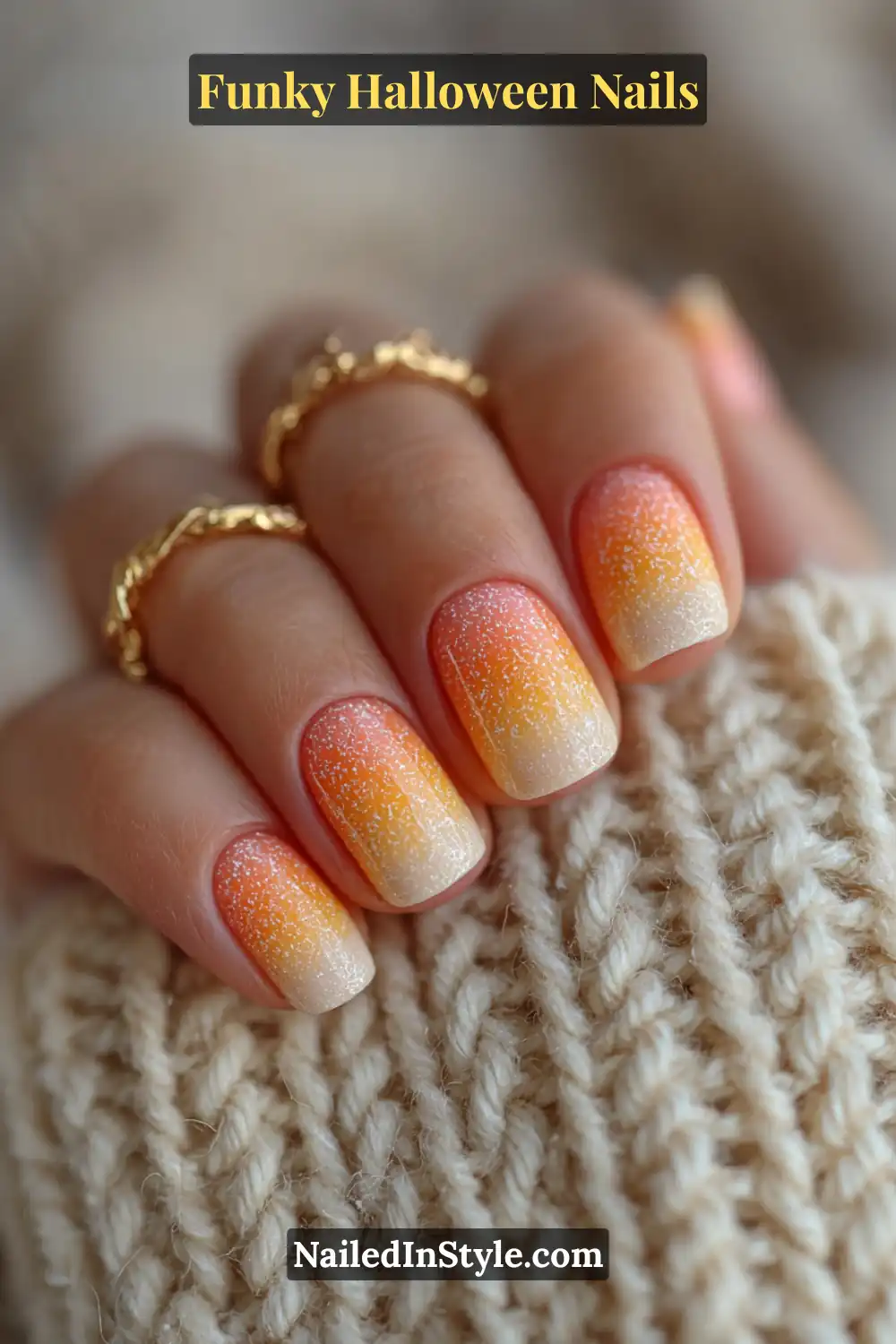 Short round nails in amber, ivory, and tangerine tones with a glossy jelly ombré finish that mimics the playful sweetness of candy corn, paired with cozy textures for a warm Halloween touch.