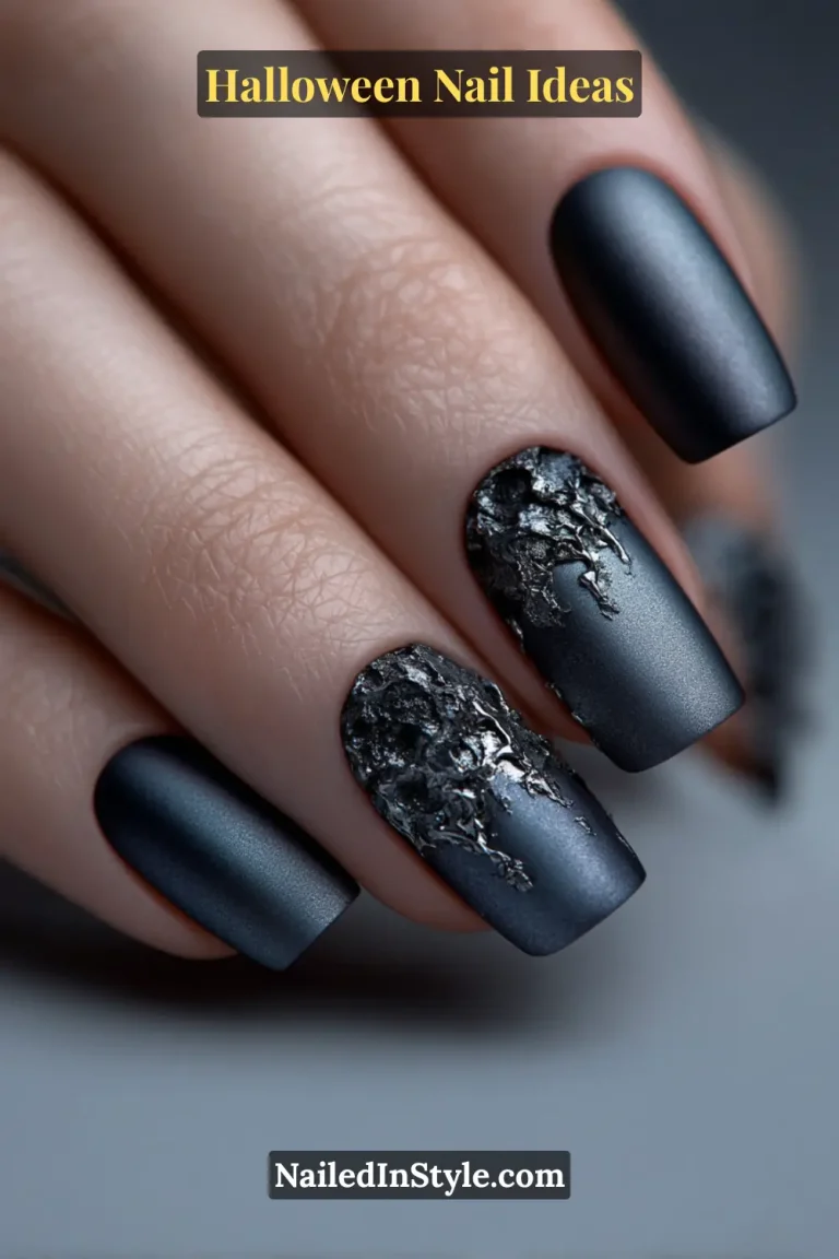 Medium square nails with a matte gunmetal base and sculpted chrome drips creating a molten 3D effect; styled with a metallic clutch for a bold, edgy Halloween aesthetic.
