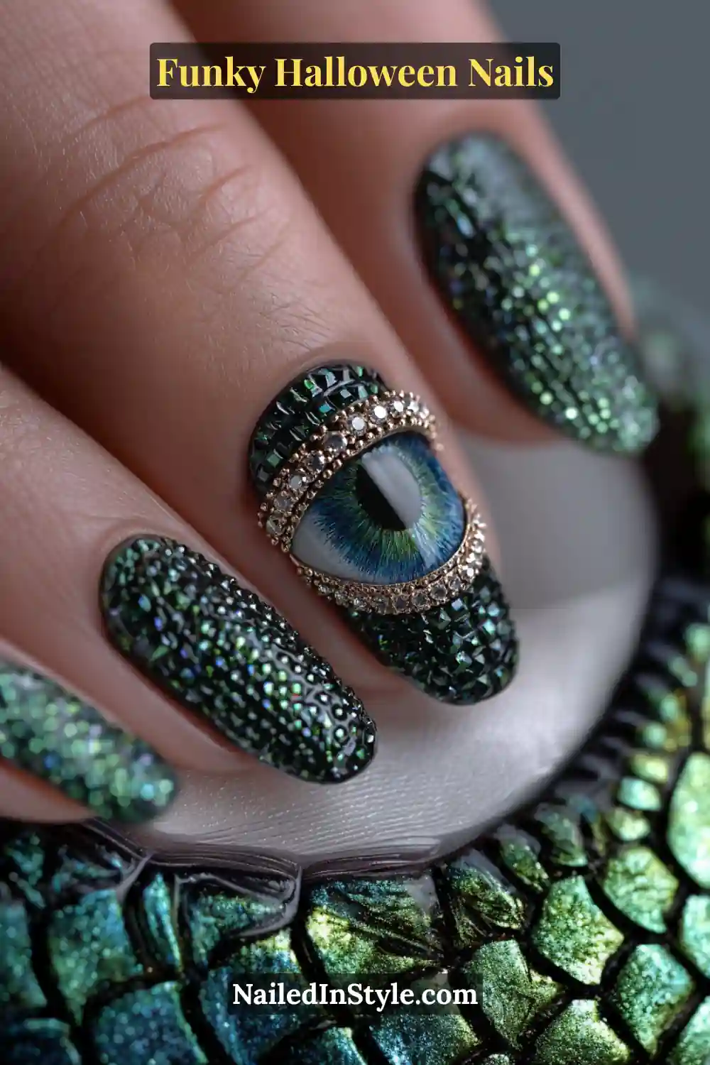 Medium almond nails in emerald, obsidian, and silver featuring 3D domed chrome eye studs over an iridescent textured base, resembling jeweled monster eyes for a bold Halloween statement.