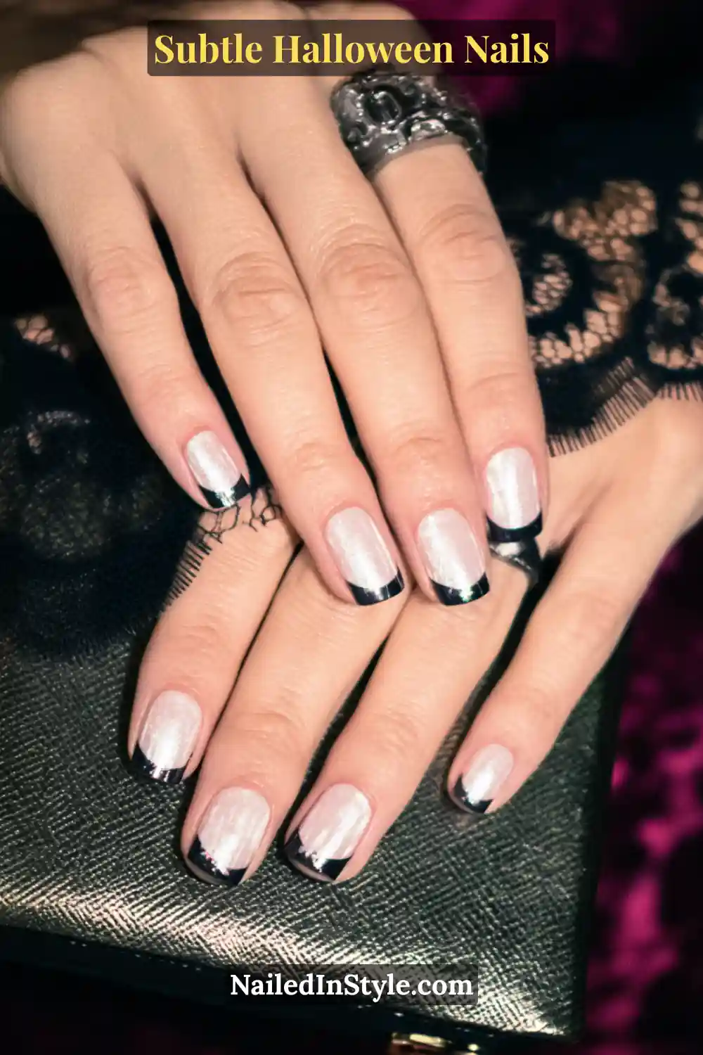 Short squoval nails with a sheer pearl base framed by twin chrome lines near each sidewall, creating a sleek mirrored edge that gleams softly under candlelight. Styled with a metallic clutch to echo the refined shimmer.