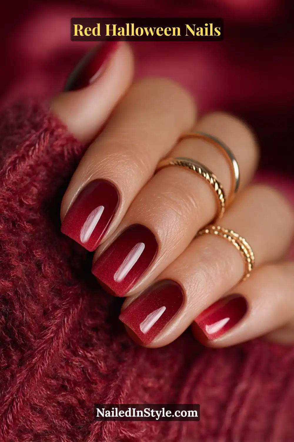 Medium round nails featuring a gradient fade from warm clove brown near the cuticle to deep red tips; glossy aura finish; paired with gold and copper rings; perfect for medium to deep skin tones with cozy autumn radiance.