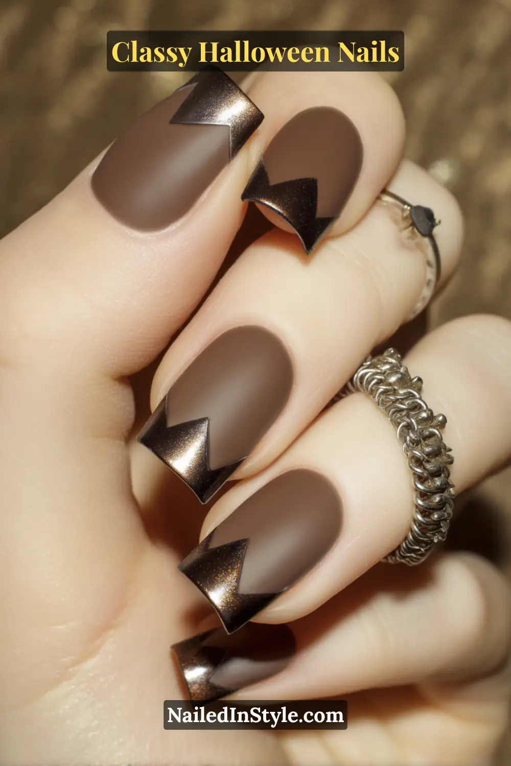 Short square nails in deep cocoa matte with metallic espresso chrome corners forming right-angle tips — a sculptural 3D texture that channels modern editorial elegance.